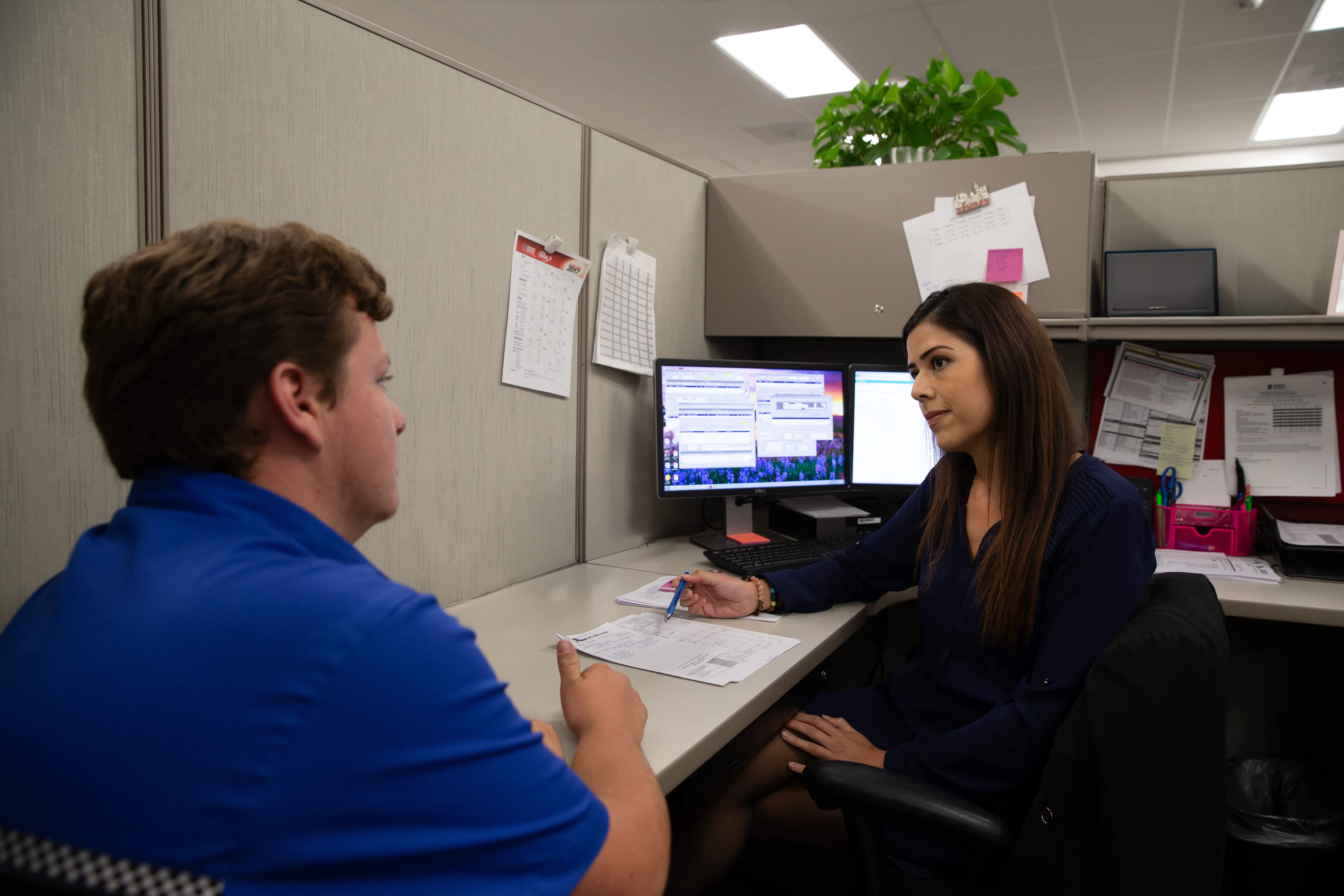 UTI student inspects and tests a heavy-duty diesel engine on a white semi.