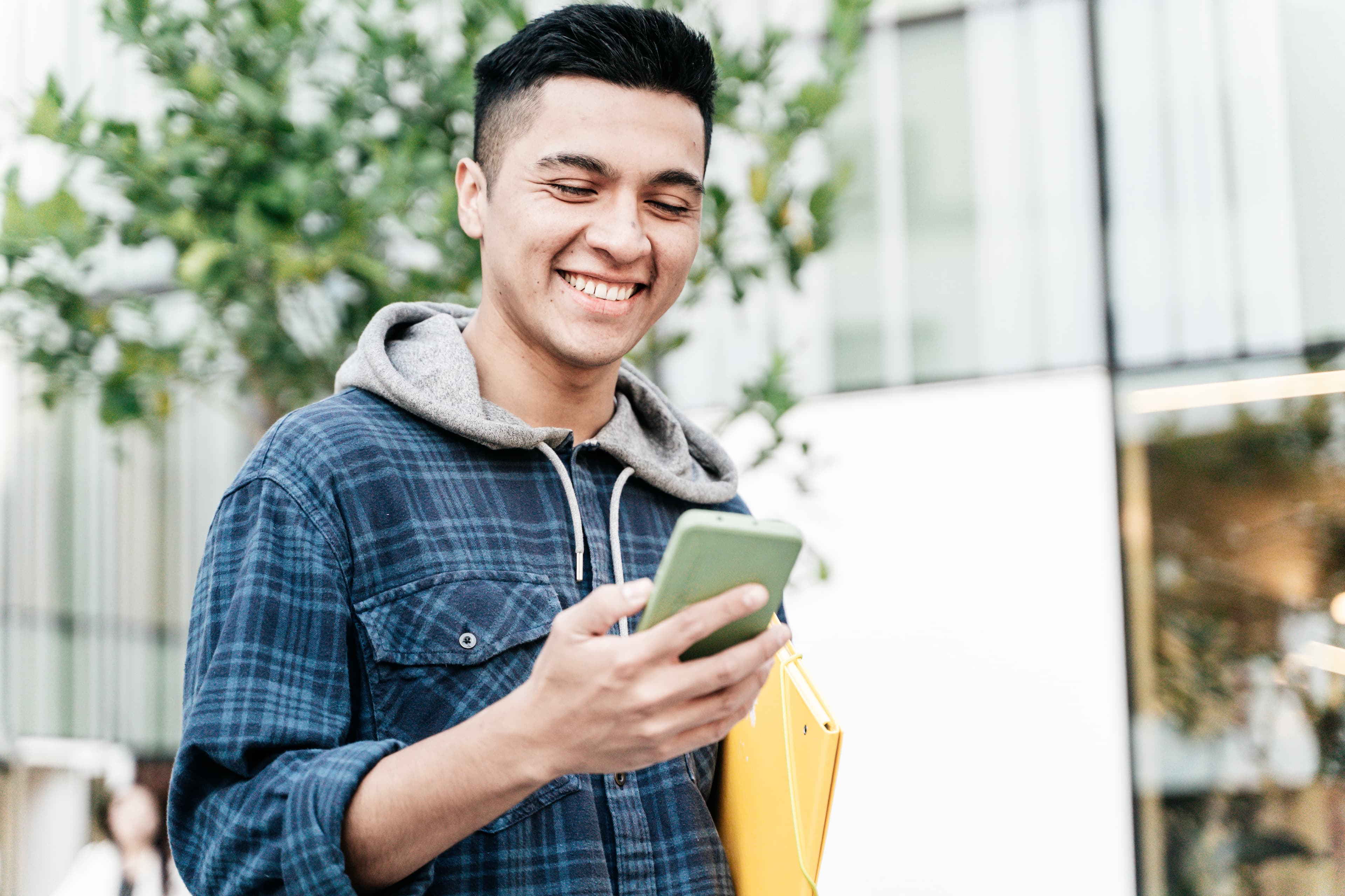 Diesel mechanic student inspecting engine belt and pulley systems during hands-on training.