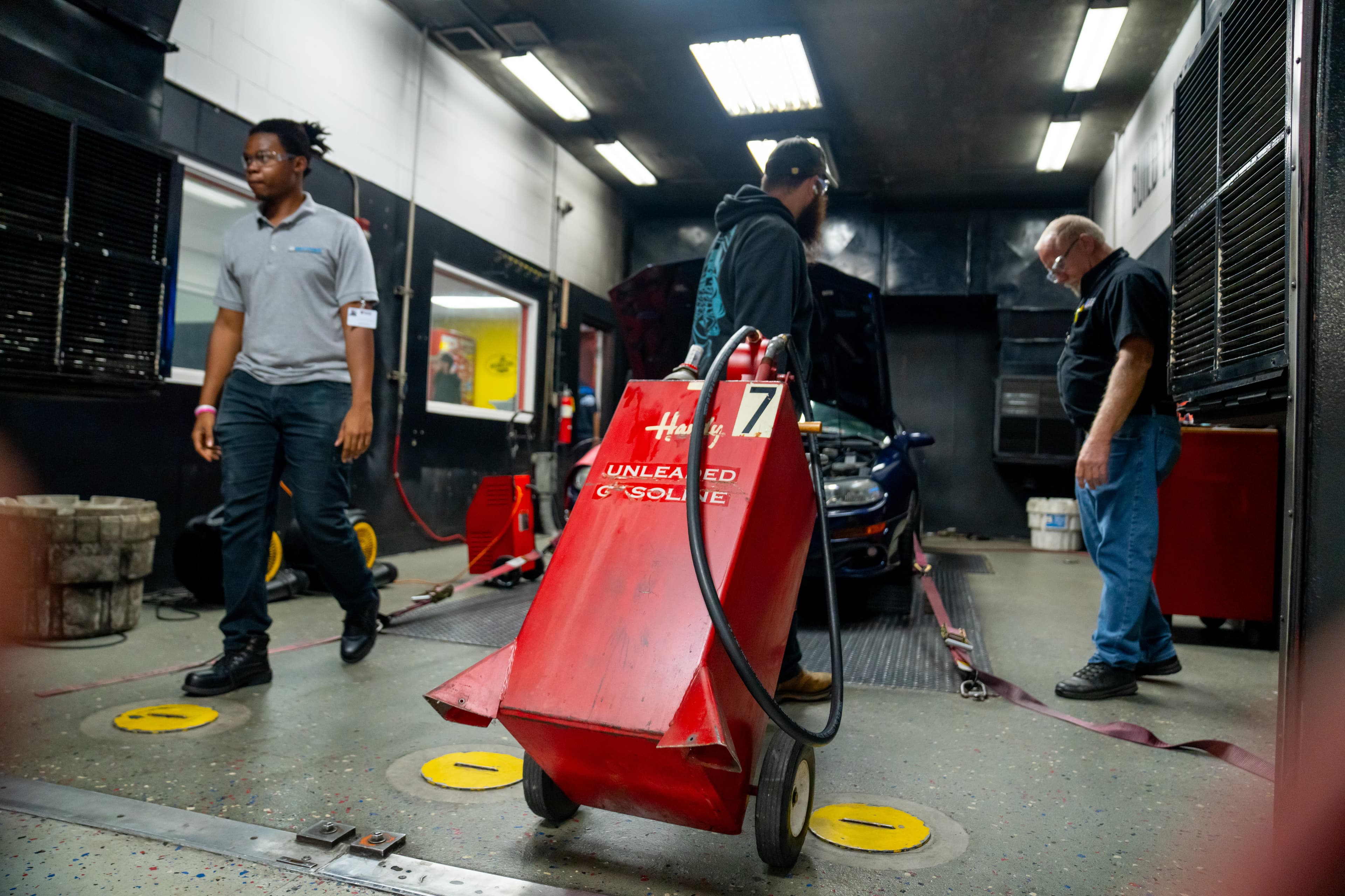 UTI student inspects and tests a heavy-duty diesel engine on a white semi.